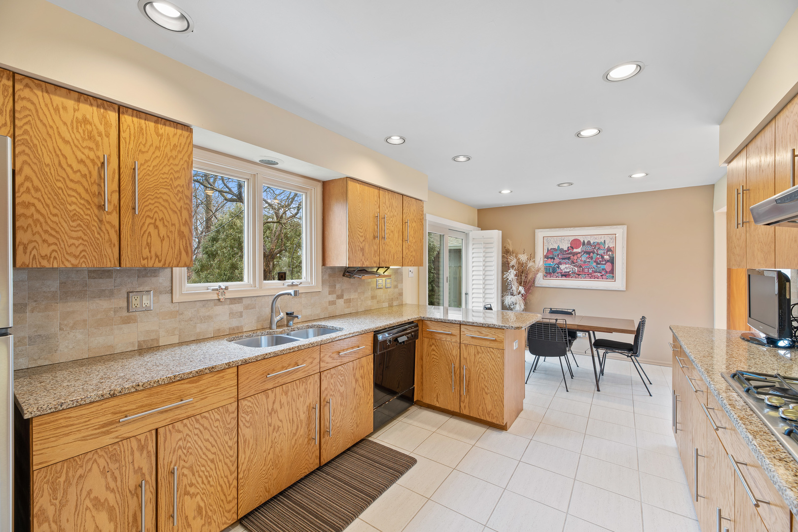 241 Ridge Road Highland Park, IL 60035 - Photo 5 of 31 a large white kitchen with a large window