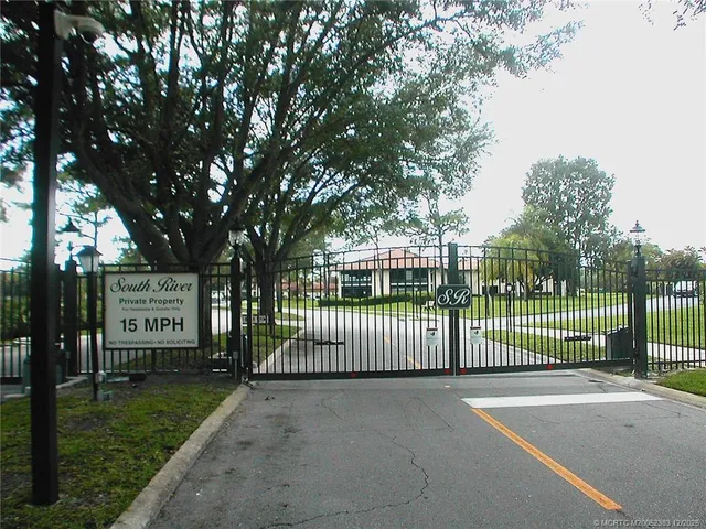 a view of a garden with a house