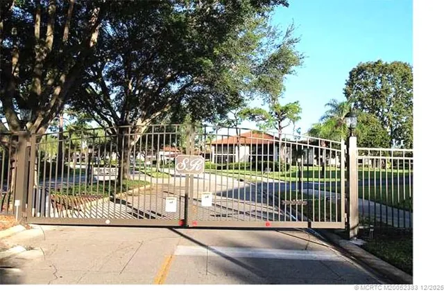 a view of a balcony with floor to ceiling windows with wooden floor