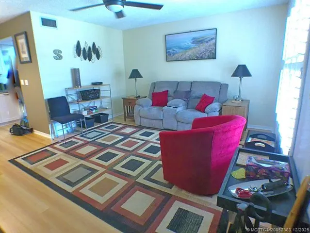 a living room with furniture and a rug