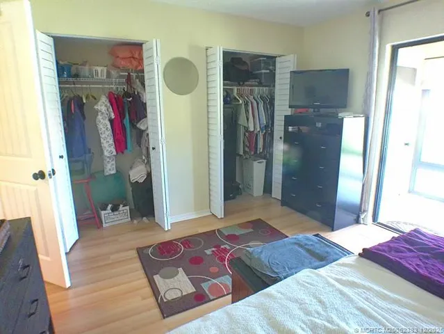 a view of an empty room with a large window