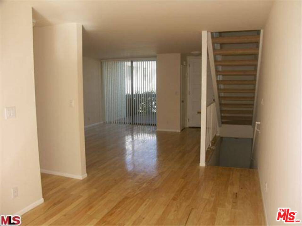 29239 Heathercliff Road, Unit 12 Malibu, CA 90265 - Photo 2 of 8 a view of entryway with wooden floor