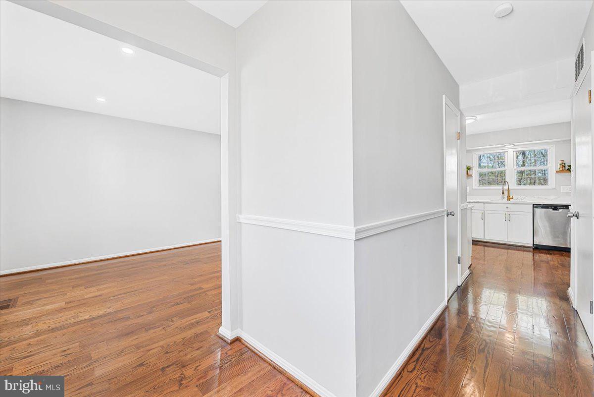 17641 Longview Lane Olney, MD 20832 - Photo 13 of 30 a view of a hallway with wooden floor