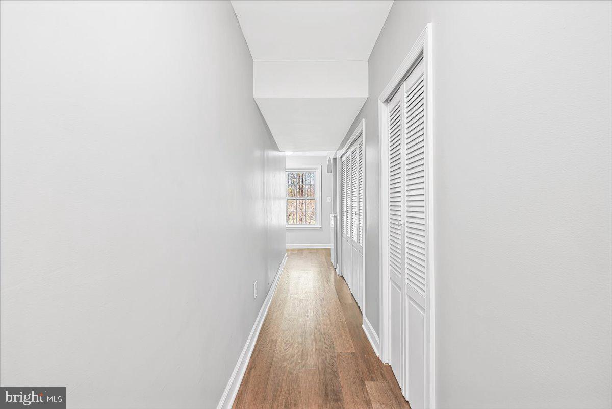 17641 Longview Lane Olney, MD 20832 - Photo 14 of 30 a view of a hallway with wooden floor
