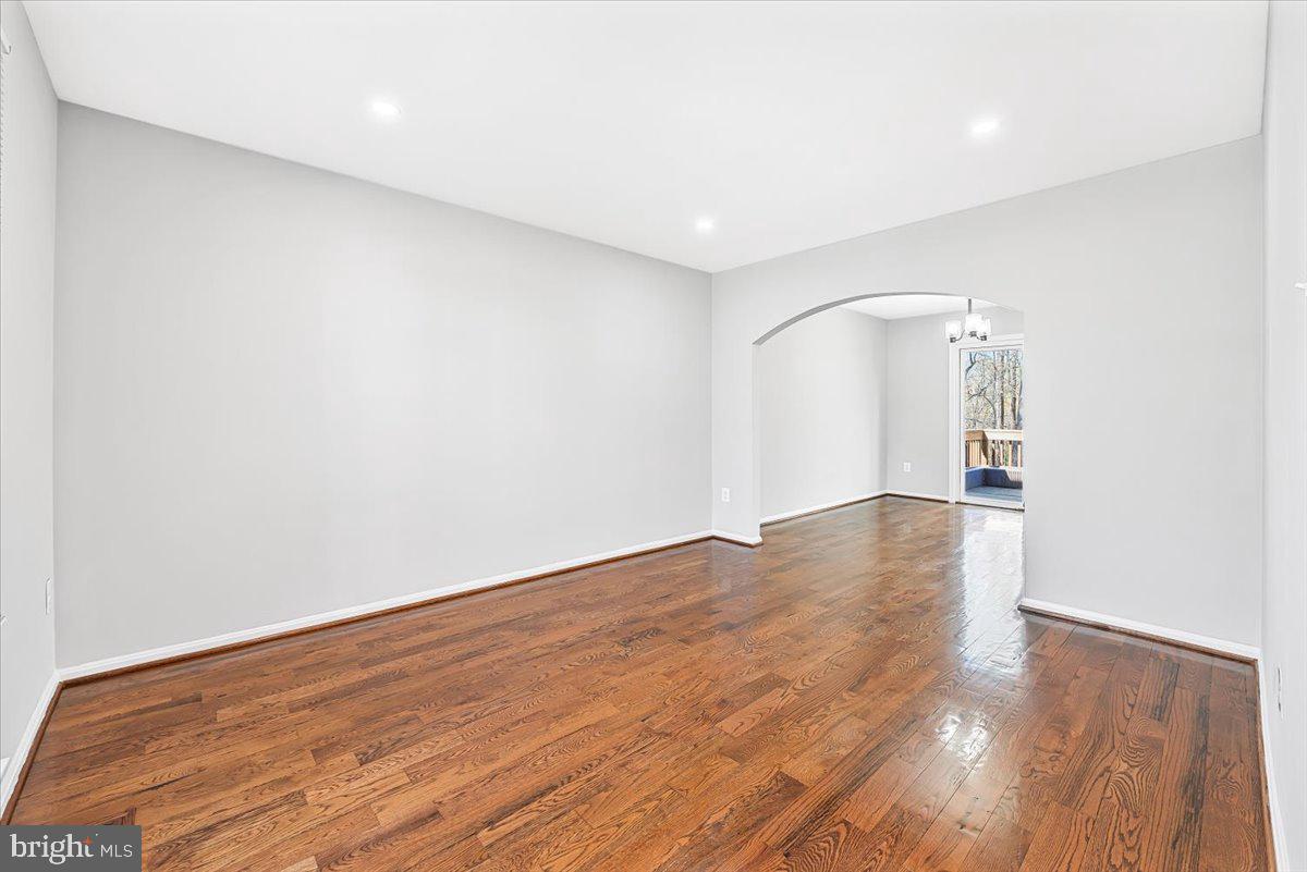 17641 Longview Lane Olney, MD 20832 - Photo 15 of 30 an empty room with wooden floor and windows