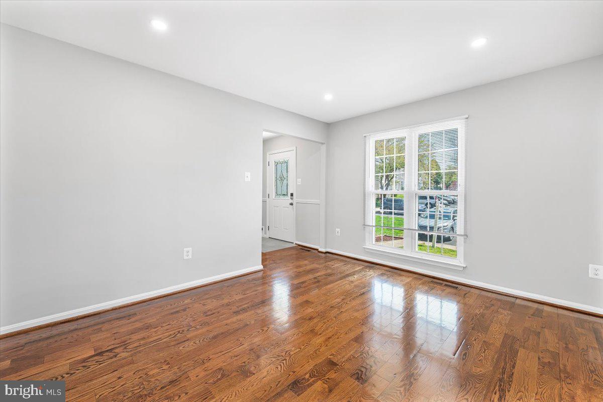 17641 Longview Lane Olney, MD 20832 - Photo 21 of 30 an empty room with wooden floor and windows