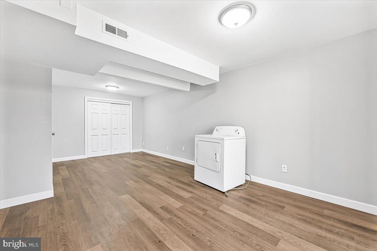 17641 Longview Lane Olney, MD 20832 - Photo 24 of 30 an empty room with wooden floor and windows