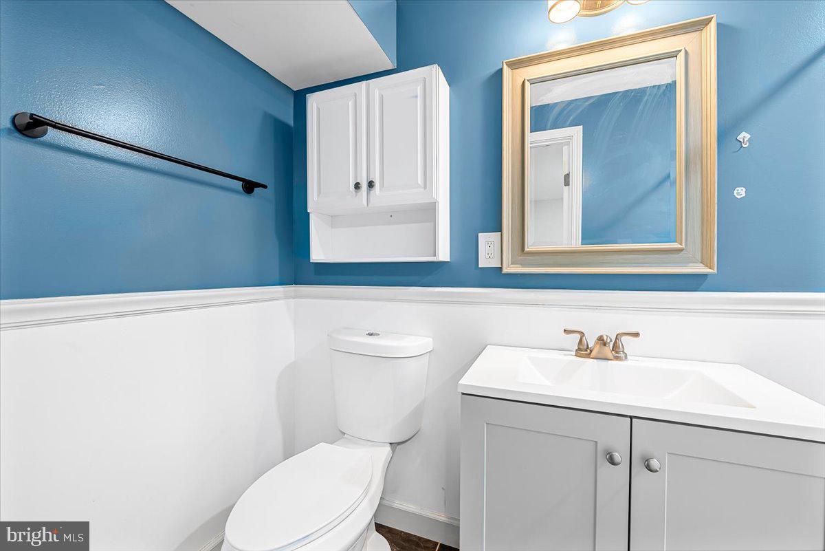 17641 Longview Lane Olney, MD 20832 - Photo 25 of 30 a bathroom with a sink a toilet and mirror
