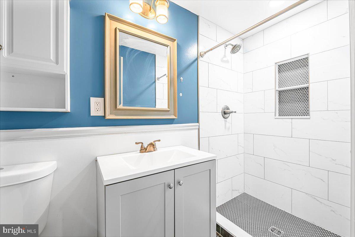 17641 Longview Lane Olney, MD 20832 - Photo 26 of 30 a bathroom with a sink and a mirror