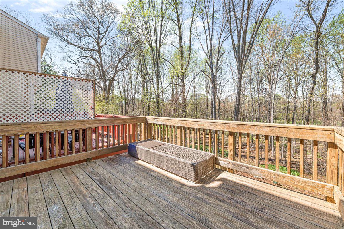 17641 Longview Lane Olney, MD 20832 - Photo 29 of 30 a view of a wooden deck with trees