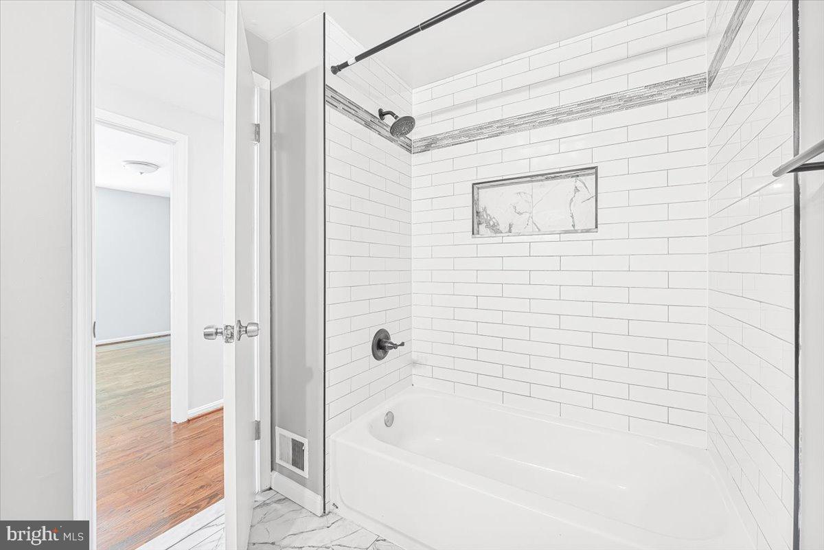 17641 Longview Lane Olney, MD 20832 - Photo 9 of 30 a bathroom with a shower