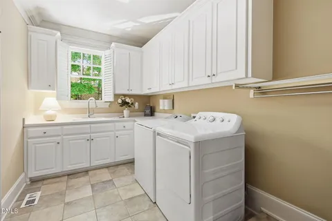 a very nice looking room with a large window and dining table
