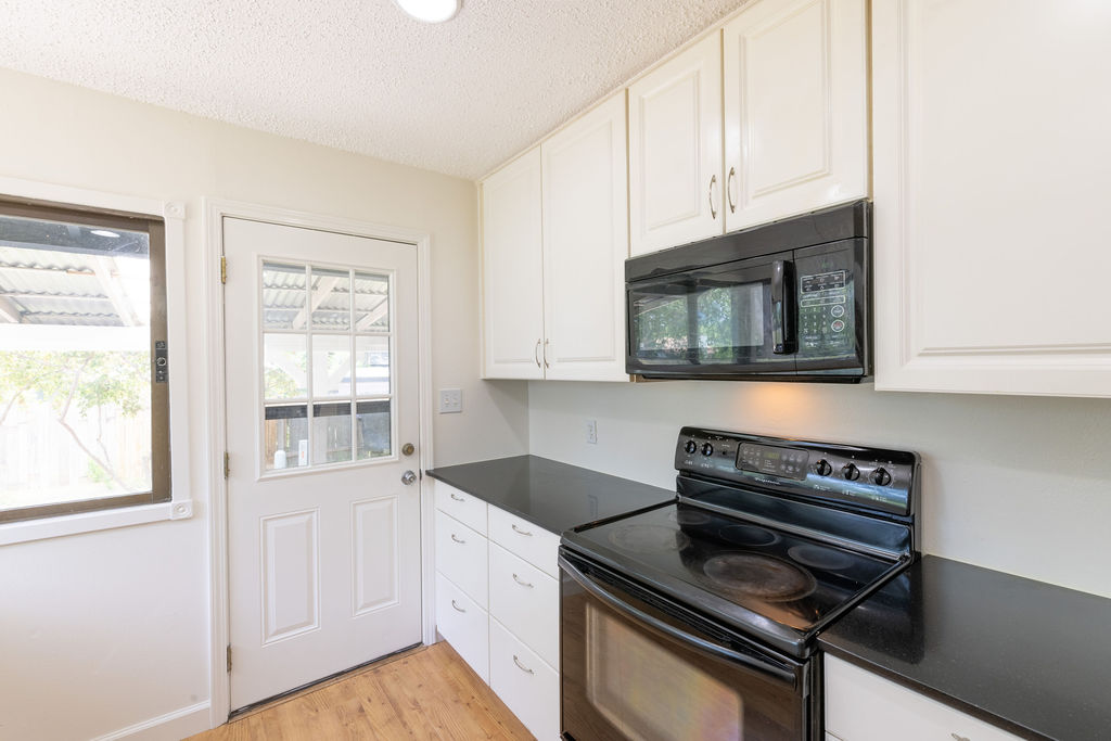 5310 Presidio Road Austin, TX 78745 - Photo 6 of 34 Functional kitchen with sleek countertops and convenient appliance placement.
