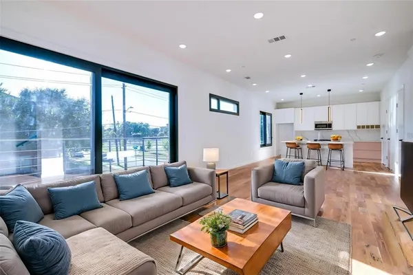 a living room with furniture and a large window