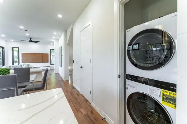 a view of a hallway with washer and dryer