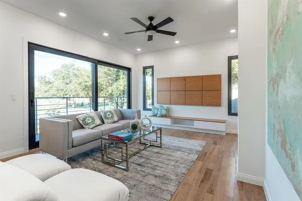a living room with furniture and a large window