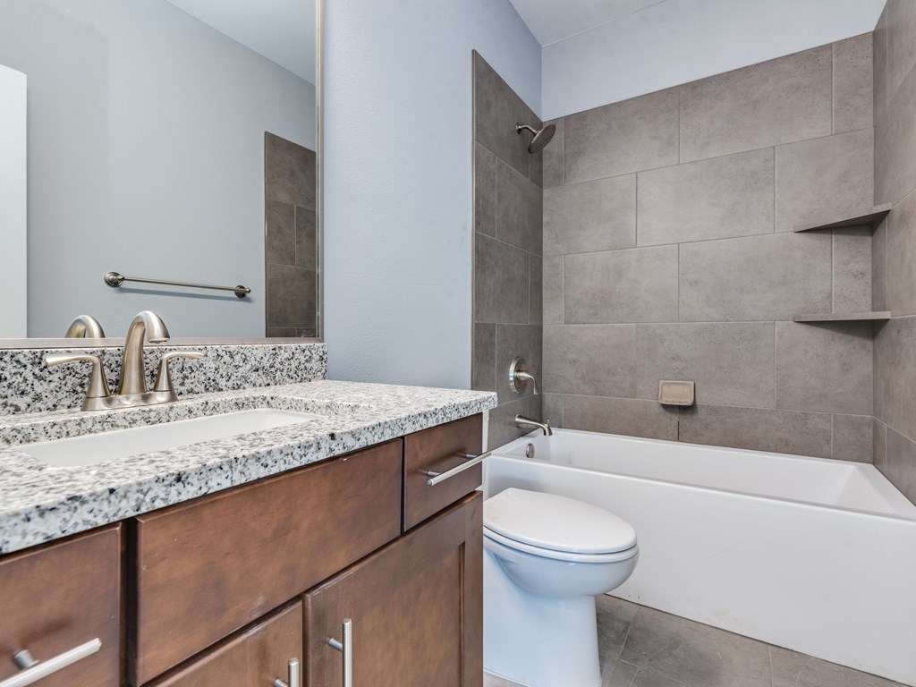 406 Post Rd Drive, Unit 1 Austin, TX 78704 - Photo 17 of 30 secondary bathroom with shower/tub combo and large sink/vanity and plenty of storage