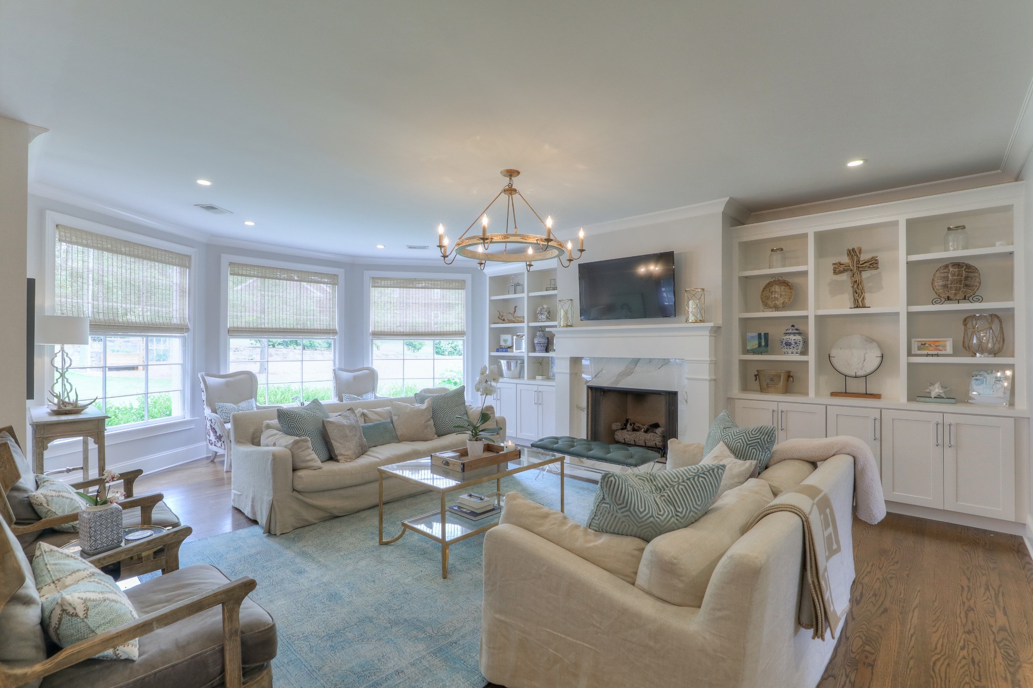 2315 Valley Brook Road Nashville, TN 37215 - Photo 13 of 67 a living room with furniture a fireplace and a chandelier