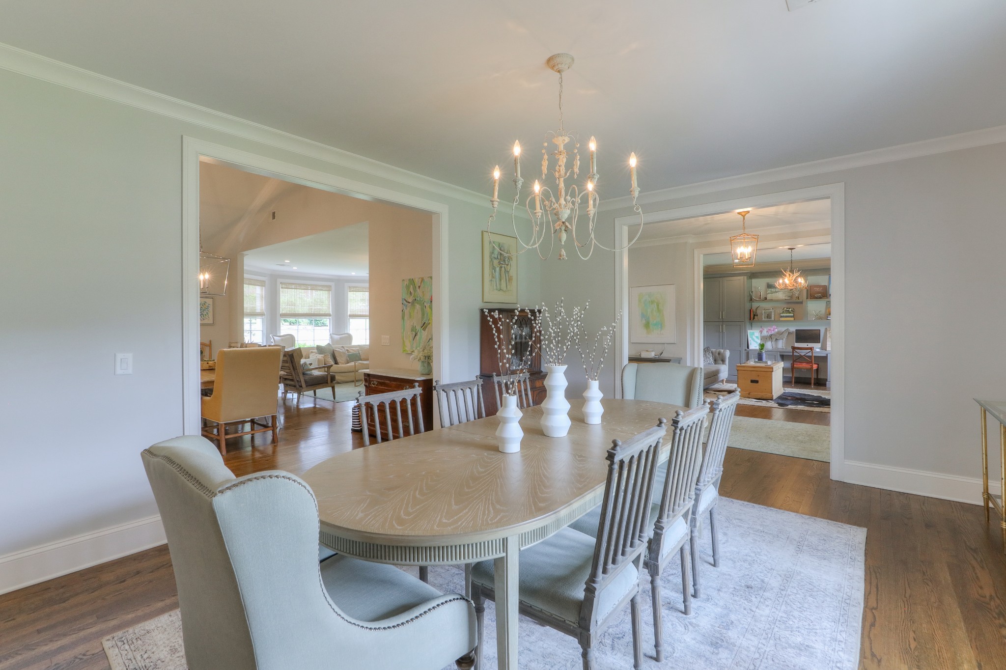 2315 Valley Brook Road Nashville, TN 37215 - Photo 14 of 67 a view of a dining room with furniture a chandelier and wooden floor