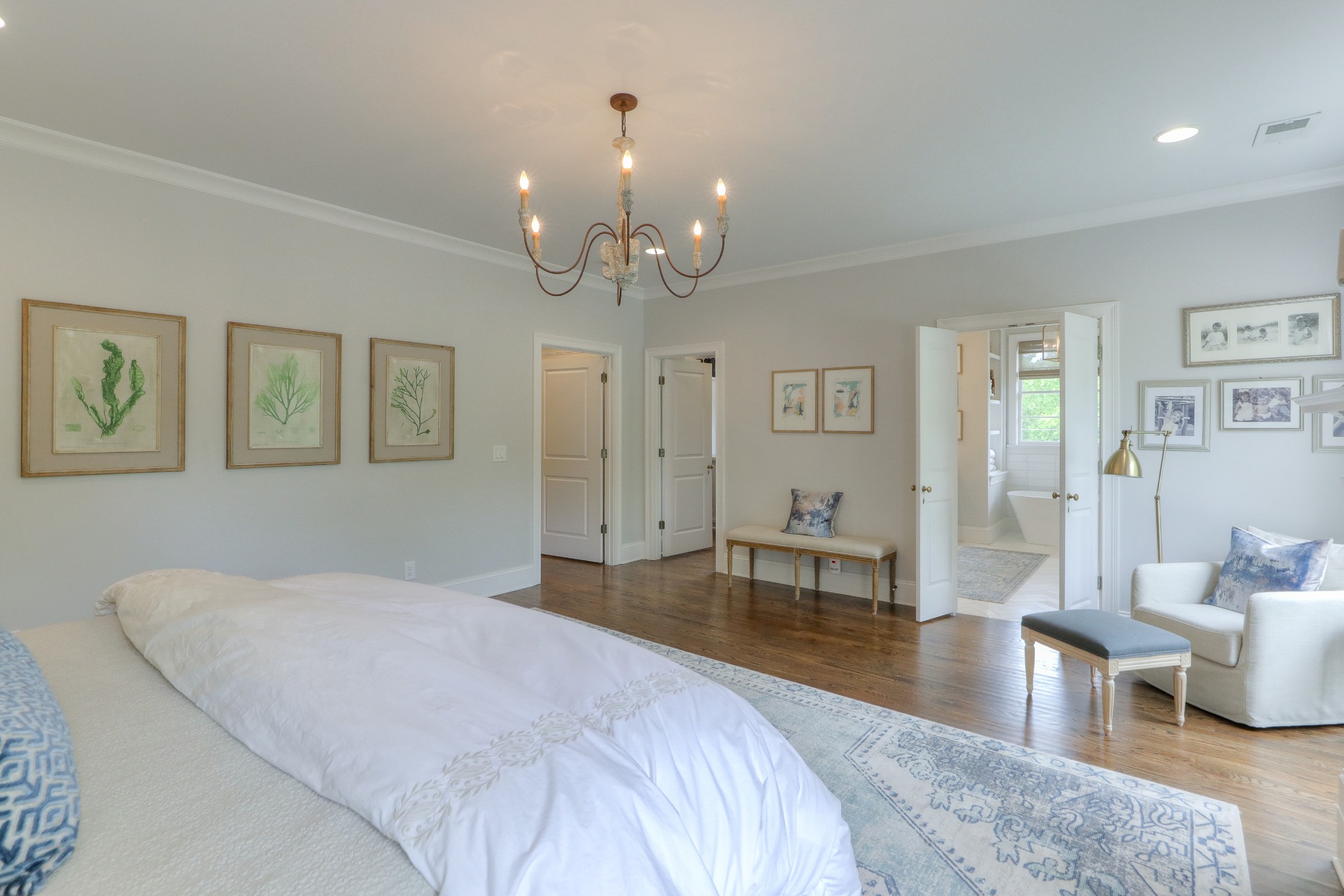 2315 Valley Brook Road Nashville, TN 37215 - Photo 17 of 67 a spacious bedroom with a large bed and a chandelier