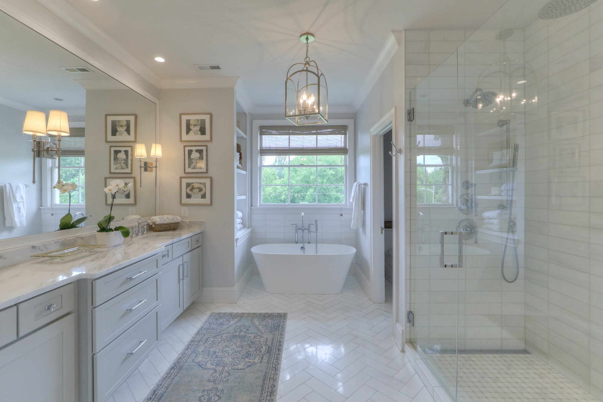 2315 Valley Brook Road Nashville, TN 37215 - Photo 18 of 67 a bathroom with a granite countertop sink a toilet a mirror and shower