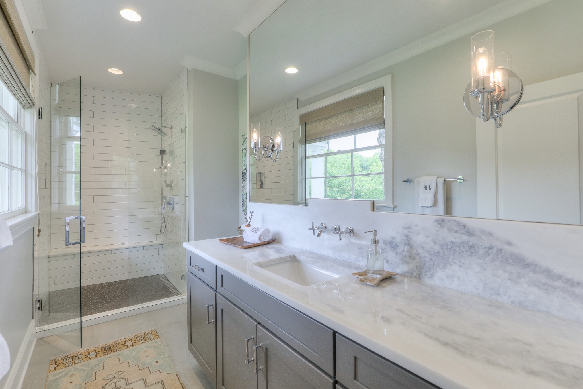 2315 Valley Brook Road Nashville, TN 37215 - Photo 37 of 67 a bathroom with a granite countertop sink mirror and shower