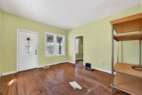 a living room with a wooden floor