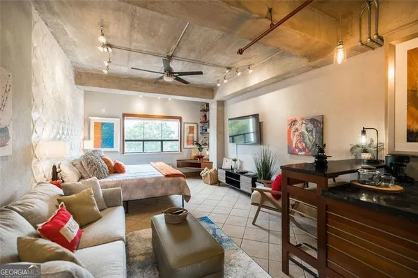 a living room with furniture and a window