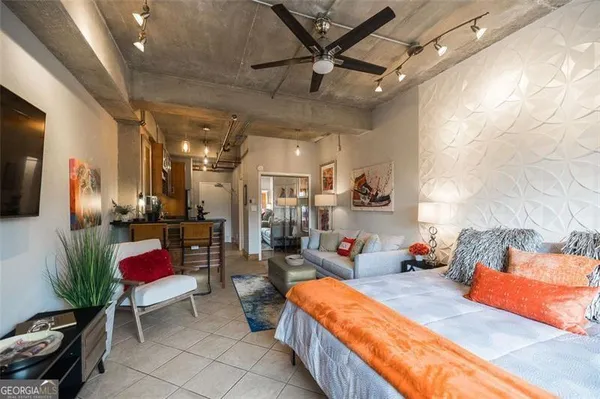 a bedroom with furniture and a bed