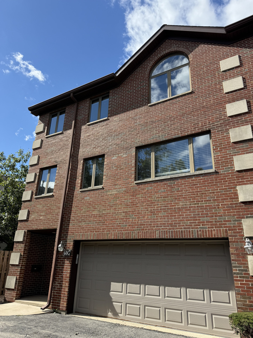 60 South Dee Road, Unit G Park Ridge, IL 60068 - Photo 1 of 1 a view of a house with many windows