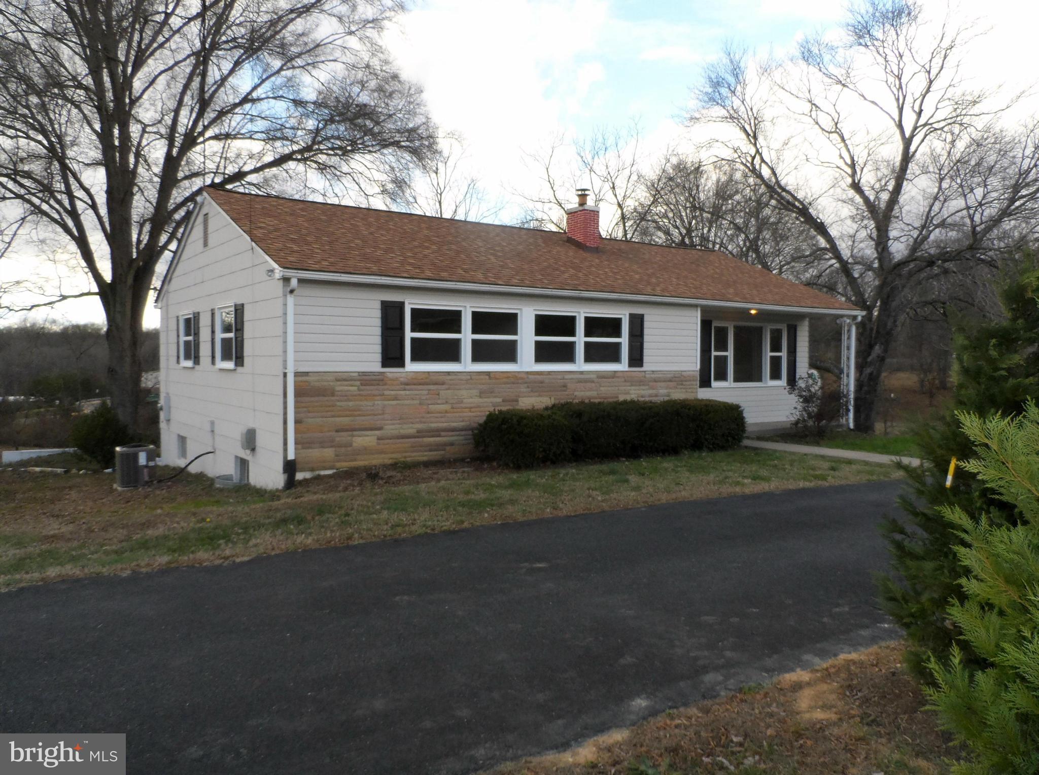 147 Deacon Road Fredericksburg, VA 22405 - Photo 2 of 16 a view of a house with a yard