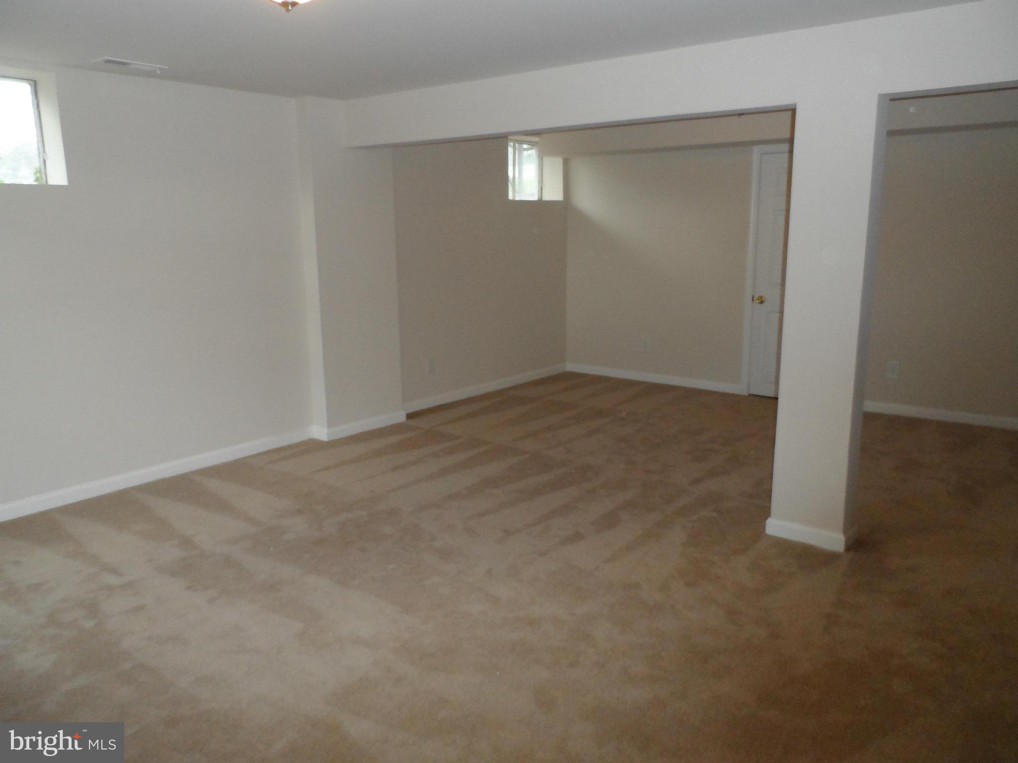 147 Deacon Road Fredericksburg, VA 22405 - Photo 14 of 16 an empty room with closet and mirror in walls