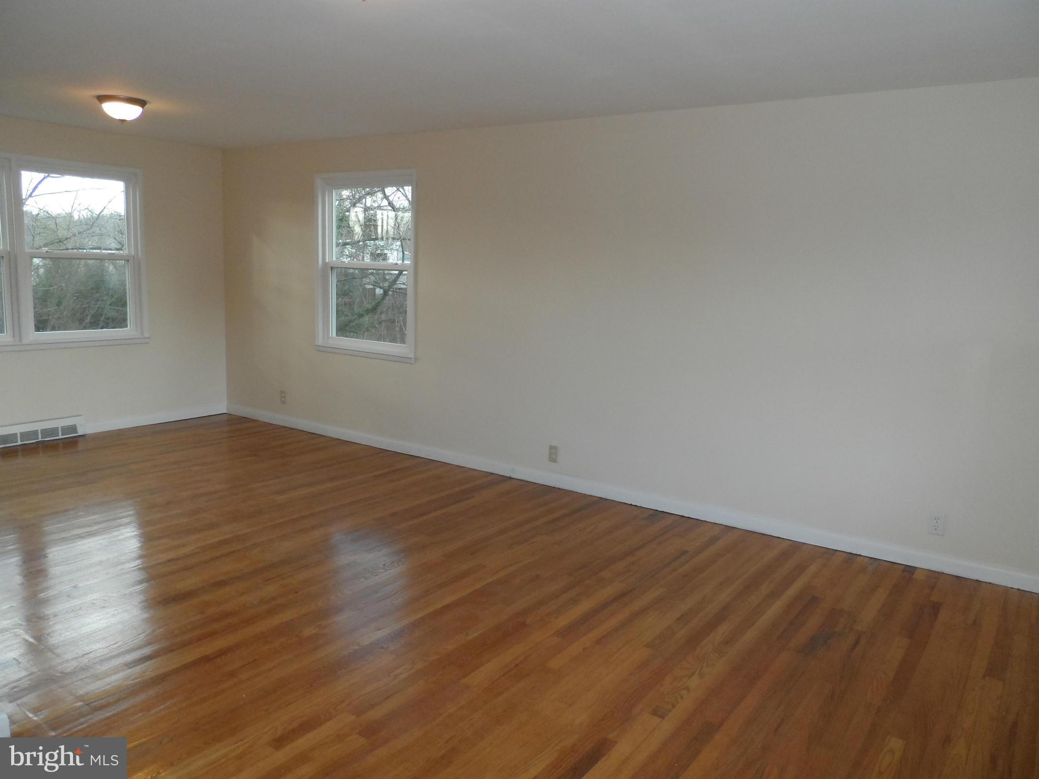 147 Deacon Road Fredericksburg, VA 22405 - Photo 3 of 16 wooden floor in an empty room with a window