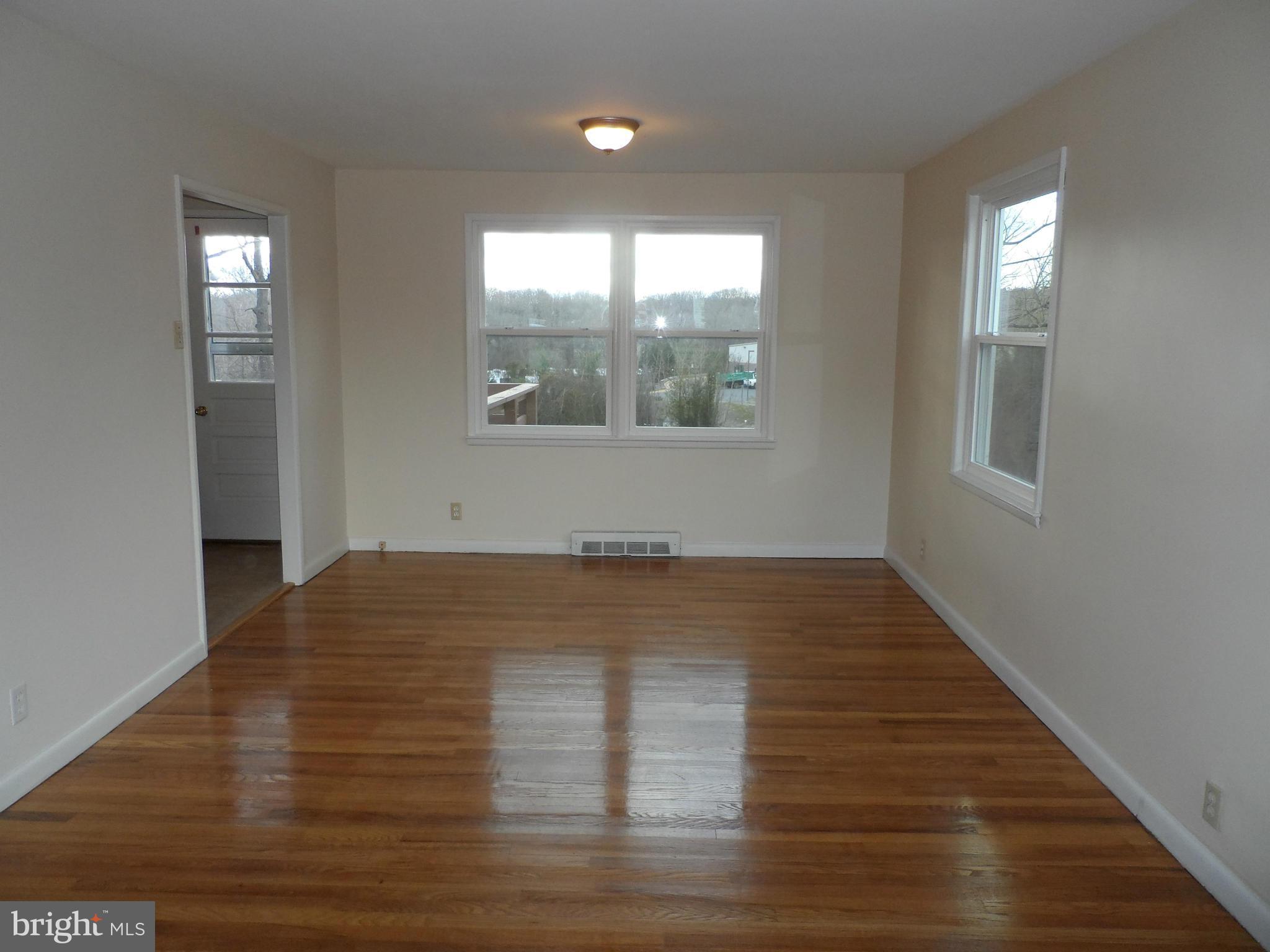 147 Deacon Road Fredericksburg, VA 22405 - Photo 5 of 16 a view of empty room with wooden floor and fan