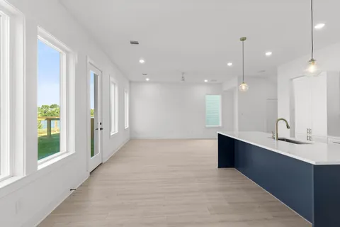 a large bathroom with a large mirror vanity and a shower