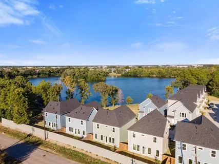 an aerial view of a house with a lake view