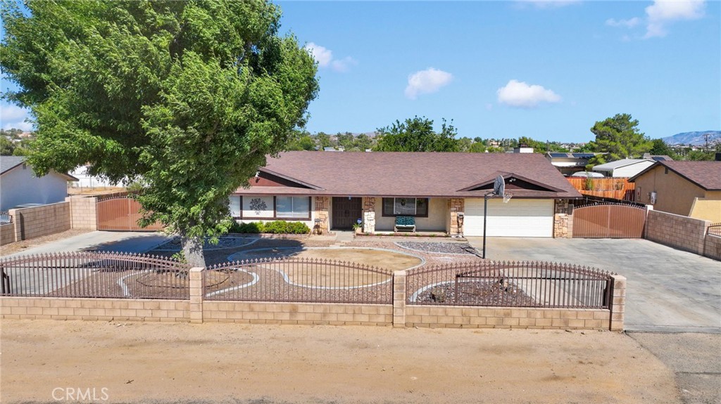 13955 Cuyamaca Road Apple Valley, CA 92307 - Photo 1 of 1 Property is fenced and cross-fenced with drive through access on EACH side of the house.