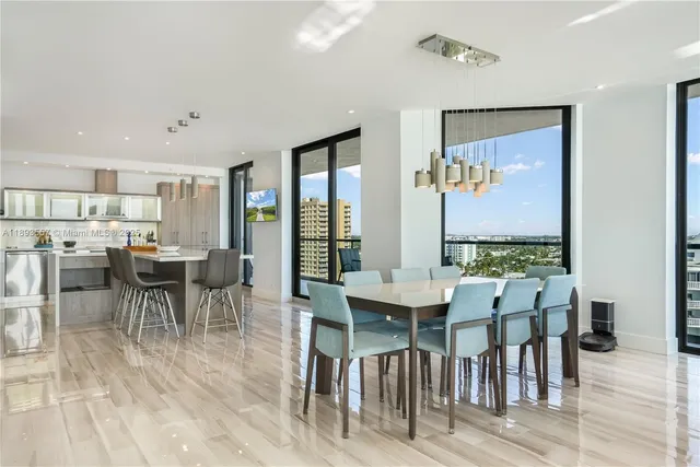 a living room with furniture and a floor to ceiling window