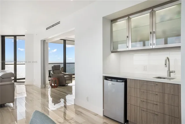 a bedroom with a large bed and a large window