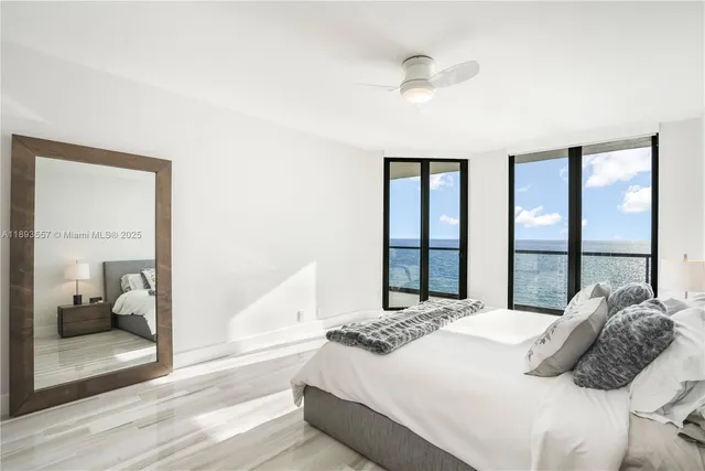 a white toilet sitting next to a sink