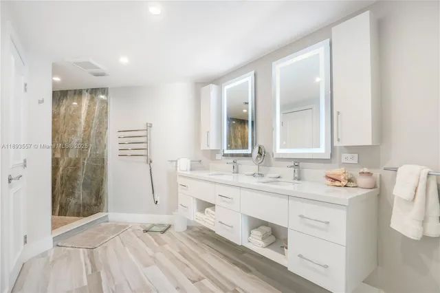 a large bed sitting in a bedroom next to a window