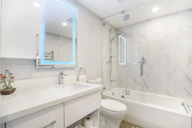 a dining room with furniture and a floor to ceiling window