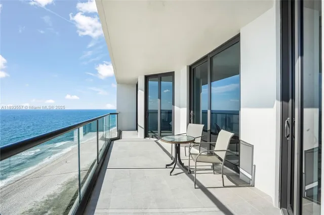 a living room with furniture and a book shelf