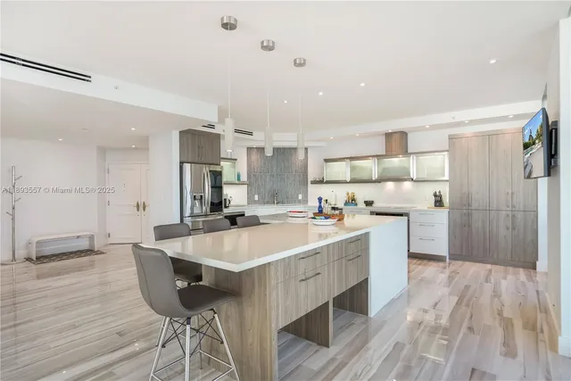 a kitchen with granite countertop a stove top oven sink and cabinets