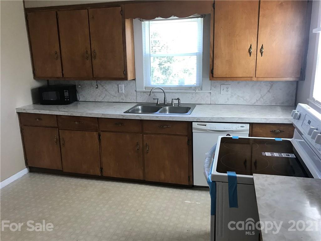 332 Crawley Drive Morganton, NC 28655 - Photo 7 of 15 a kitchen with a sink and cabinets