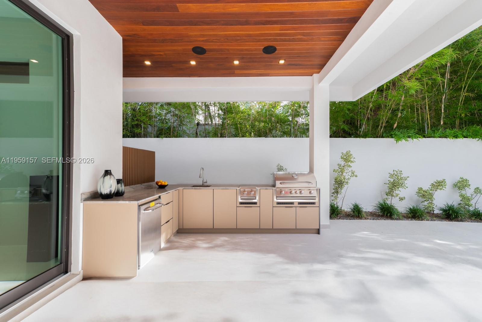 1780 Chucunantah Road Miami, FL 33133 - Photo 17 of 34 a kitchen with stove and cabinets