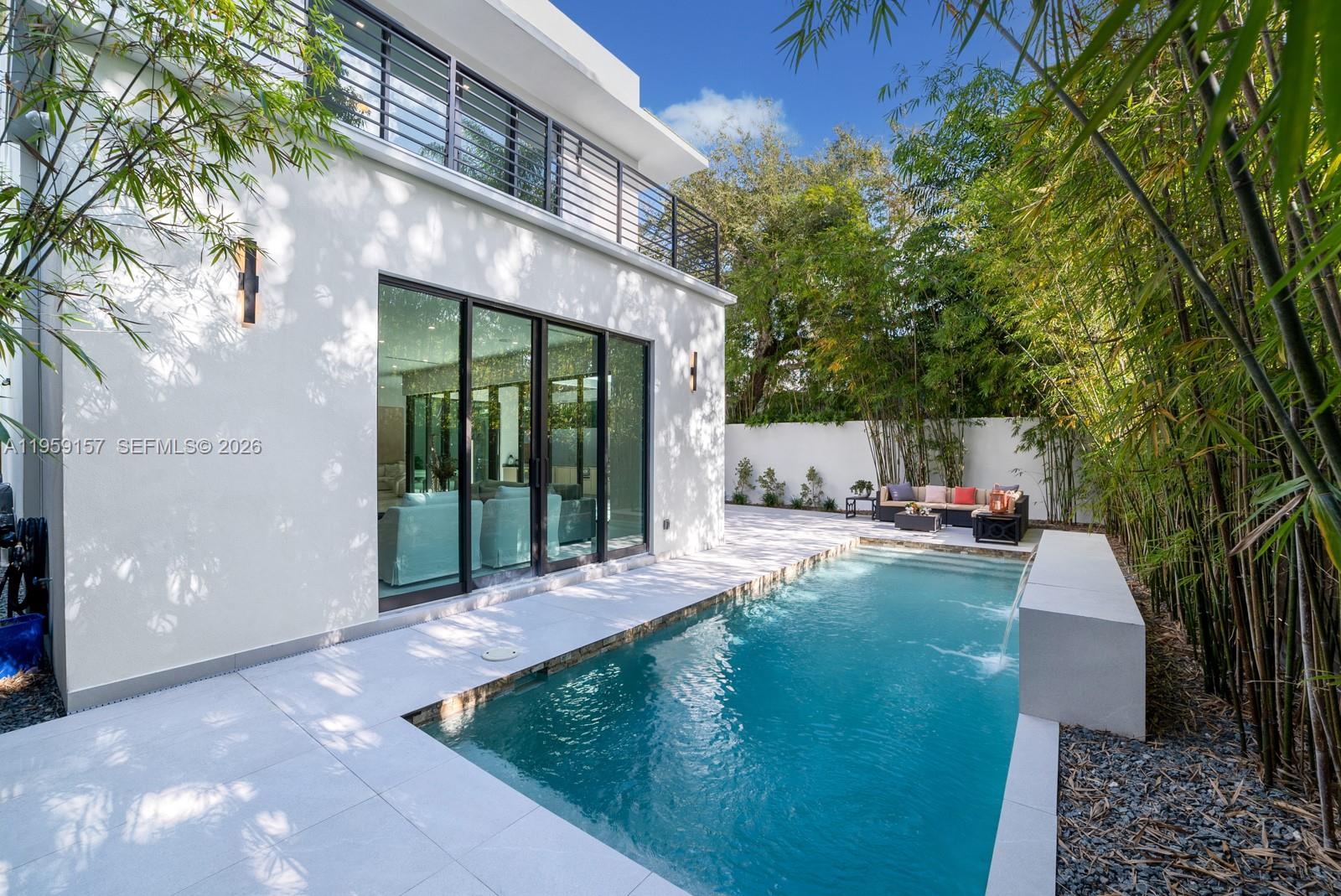 1780 Chucunantah Road Miami, FL 33133 - Photo 20 of 34 a view of a house with backyard and sitting area