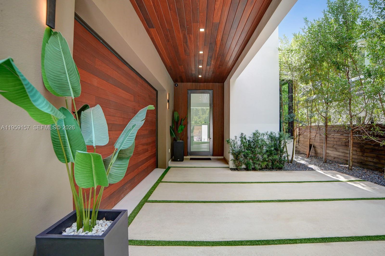 1780 Chucunantah Road Miami, FL 33133 - Photo 2 of 34 a front view of a house with garden