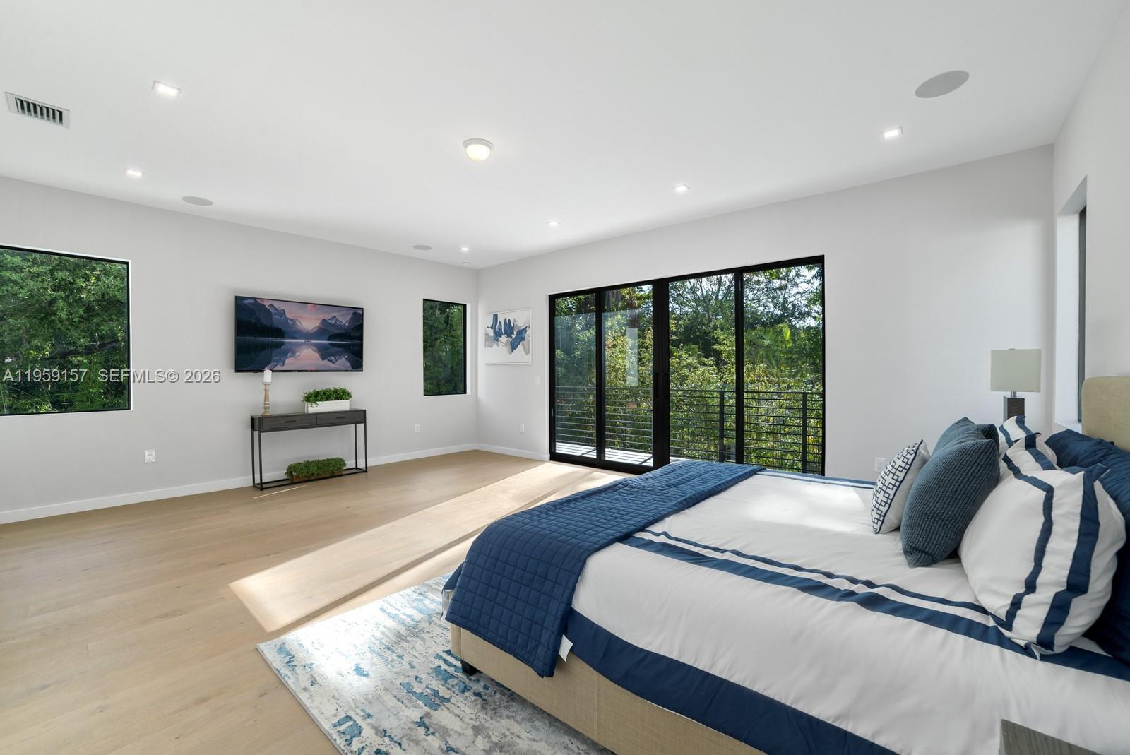 1780 Chucunantah Road Miami, FL 33133 - Photo 24 of 34 a bedroom with a bed and large window