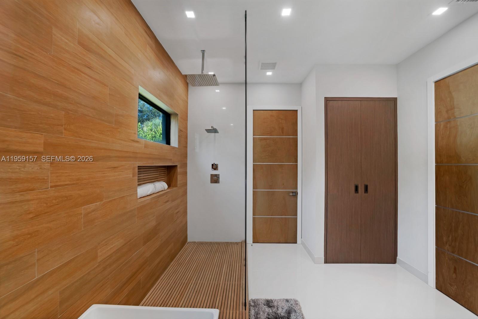 1780 Chucunantah Road Miami, FL 33133 - Photo 27 of 34 a view of a hallway with wooden shelves